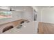 Open concept kitchen featuring island with countertop, bar seating, and bright living area at 5200 Blanton Dr, Las Vegas, NV 89122