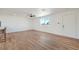 Open living room features wood-look floors, ample natural light, and a ceiling fan at 5200 Blanton Dr, Las Vegas, NV 89122