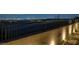 Elevated backyard with retaining wall, iron fence and landscape lighting overlooking the city at 5234 Savannah Rose St, Las Vegas, NV 89149