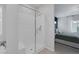 Modern bathroom featuring a glass shower and view of the main bedroom at 5234 Savannah Rose St, Las Vegas, NV 89149