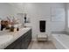 Elegant bathroom with double vanity, granite countertop, and soaking tub at 5234 Savannah Rose St, Las Vegas, NV 89149
