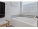 Bright bathroom showcasing a soaking tub beneath a window at 5234 Savannah Rose St, Las Vegas, NV 89149