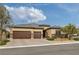 Charming single story home with a three car garage and a beautifully landscaped front yard at 5234 Savannah Rose St, Las Vegas, NV 89149