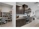 Well-equipped kitchen with granite counters, stainless appliances, and a convenient walk-in pantry at 5234 Savannah Rose St, Las Vegas, NV 89149