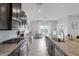 Bright kitchen offers lots of counter space, modern appliances and a seamless flow into a casual living space at 5234 Savannah Rose St, Las Vegas, NV 89149