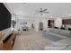 Open concept living room with tile floors, living room furniture, and kitchen and dining space at 5234 Savannah Rose St, Las Vegas, NV 89149