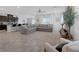 Bright open floor plan with a view from the living room into the kitchen, featuring tile flooring at 5234 Savannah Rose St, Las Vegas, NV 89149