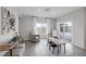 Bright living area with a cozy sitting area next to sliding glass doors for easy access to the backyard at 5234 Savannah Rose St, Las Vegas, NV 89149