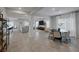 Open concept living space with tile floors, large windows, and modern decor at 5234 Savannah Rose St, Las Vegas, NV 89149