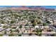 Panoramic aerial shot showing a neighborhood set against mountains, capturing the community vibe and scenic backdrop at 524 Hopi Pl, Boulder City, NV 89005