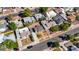 Wide aerial view of a neighborhood with a compact home featuring a tidy yard and covered parking at 524 Hopi Pl, Boulder City, NV 89005