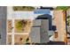 Aerial view of a well-maintained home with a landscaped front yard, shaded parking, and backyard area at 524 Hopi Pl, Boulder City, NV 89005