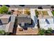 An aerial perspective of a cozy home showcasing a tidy yard, shaded parking, and proximity to other houses at 524 Hopi Pl, Boulder City, NV 89005