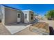 This backyard boasts two access doors and a custom garden bed at 524 Hopi Pl, Boulder City, NV 89005