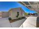 Backyard featuring manicured landscaping, covered parking and a single-story home at 524 Hopi Pl, Boulder City, NV 89005