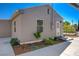 Exterior view of backyard featuring manicured landscaping and covered parking at 524 Hopi Pl, Boulder City, NV 89005