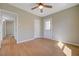 Spacious bedroom with wood-look floors and multiple entry doors at 524 Hopi Pl, Boulder City, NV 89005