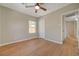 Inviting bedroom with wood-look floors, ceiling fan and neutral paint at 524 Hopi Pl, Boulder City, NV 89005