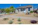 Well-kept single-story house with a xeriscaped yard featuring desert plants and rock accents at 524 Hopi Pl, Boulder City, NV 89005
