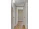 Hallway features tiled floors, neutral paint, and white doors at 524 Hopi Pl, Boulder City, NV 89005