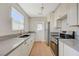 Galley kitchen features stainless steel appliances, stone countertops and ample cabinet space at 524 Hopi Pl, Boulder City, NV 89005