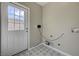 Laundry area image displays tile floors and a utility hookup at 524 Hopi Pl, Boulder City, NV 89005
