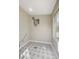 View of the Laundry Room features modern tile, tankless water heater, and a window at 524 Hopi Pl, Boulder City, NV 89005