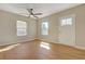 Sunlit living room featuring hardwood floors and large windows at 524 Hopi Pl, Boulder City, NV 89005