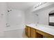 Bright bathroom with a large mirror, vanity, and combined tub and shower; convenient layout at 525 Indian Princess Dr # 101, Las Vegas, NV 89145