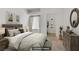 This is a staged primary bedroom with a walk-in closet; comfortable living space at 525 Indian Princess Dr # 101, Las Vegas, NV 89145
