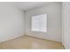 Bright, empty bedroom with hardwood floors, white walls, and a window at 525 Indian Princess Dr # 101, Las Vegas, NV 89145