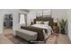 This is a staged primary bedroom with a walk-in closet; modern bedroom design at 525 Indian Princess Dr # 101, Las Vegas, NV 89145