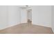 Large room with door to another room, and beige carpet at 525 Indian Princess Dr # 101, Las Vegas, NV 89145