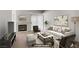 Cozy living room with a white fireplace, ample seating, and neutral tones at 525 Indian Princess Dr # 101, Las Vegas, NV 89145