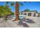 Relaxing backyard boasts a sparkling in-ground pool and mature landscaping at 5279 Consul Ave, Las Vegas, NV 89142