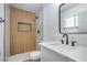 Stylish bathroom showcases modern tiling, walk-in shower and sleek vanity with black hardware at 5279 Consul Ave, Las Vegas, NV 89142