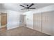 Bedroom features a ceiling fan, closet, and doorway to the bathroom at 5279 Consul Ave, Las Vegas, NV 89142