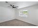 Bedroom featuring a ceiling fan and window overlooking the yard at 5279 Consul Ave, Las Vegas, NV 89142