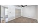 Another view of the carpeted bedroom with a fan and closet at 5279 Consul Ave, Las Vegas, NV 89142