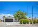 Well-maintained single-story home with gravel landscaping, a tree, and a two-car garage at 5279 Consul Ave, Las Vegas, NV 89142