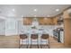Newly renovated kitchen features an island with seating, updated cabinets, new appliances, and a modern design at 5279 Consul Ave, Las Vegas, NV 89142