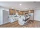 Updated kitchen features stainless steel appliances, a kitchen island, and modern cabinetry at 5279 Consul Ave, Las Vegas, NV 89142