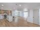 Expansive living space showcasing a modern kitchen island and a bright open layout with neutral tones at 5279 Consul Ave, Las Vegas, NV 89142