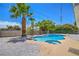 Sparkling in-ground pool features a spa, mature landscaping, and sunny patio at 5279 Consul Ave, Las Vegas, NV 89142