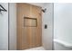 Modern shower featuring wood-look tile and built in niche at 5279 Consul Ave, Las Vegas, NV 89142