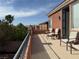 Balcony with three chair sets offering scenic neighborhood views at 530 Calahonda Ct, Las Vegas, NV 89138