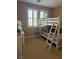 Bright ' bedroom with a bunk bed, a desk, and a window with white shutters at 530 Calahonda Ct, Las Vegas, NV 89138