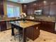 Gourmet kitchen with granite countertops, custom cabinets, stainless steel appliances, and a center island at 530 Calahonda Ct, Las Vegas, NV 89138