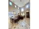 Elegant living room with high ceilings, marble floors, a dining area, and a comfortable seating arrangement at 530 Calahonda Ct, Las Vegas, NV 89138