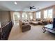 Expansive upstairs loft area with a large sectional sofa and an arched architectural design at 530 Calahonda Ct, Las Vegas, NV 89138